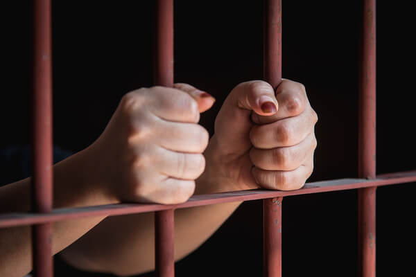 Woman-Hand-In-Jail